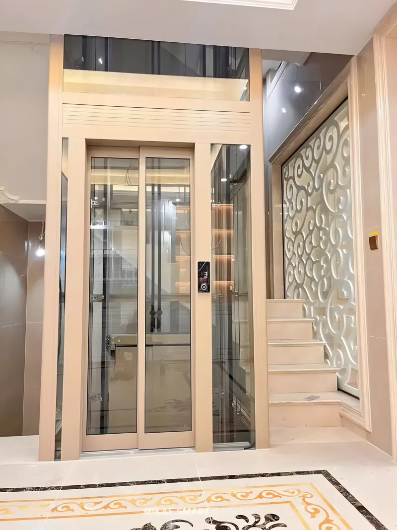 Thang máy gia đình lồng kính khung be, champagne